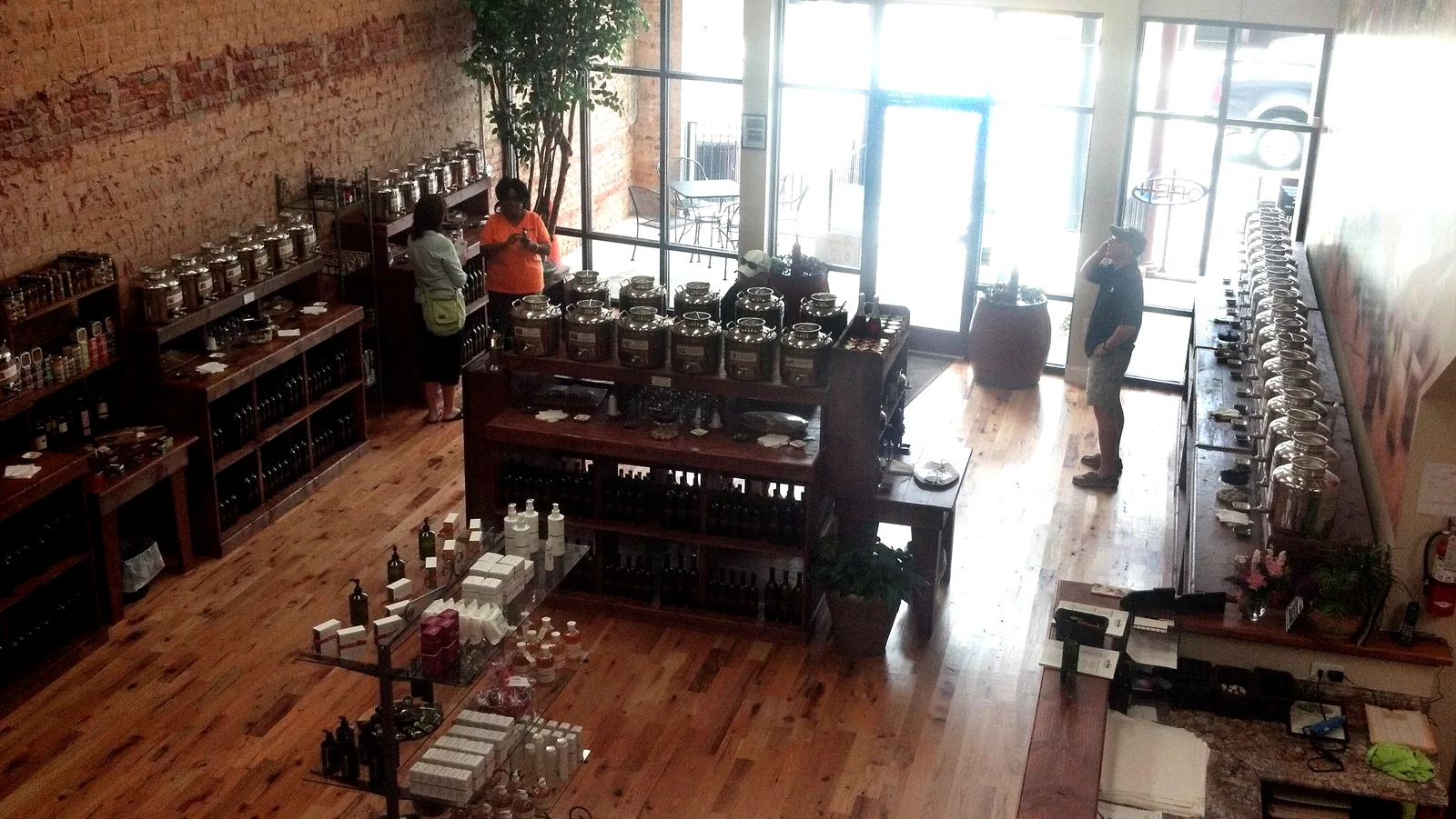 Shoppers browse the shelves inside The Enchanted Olive, a shop in Mooresville