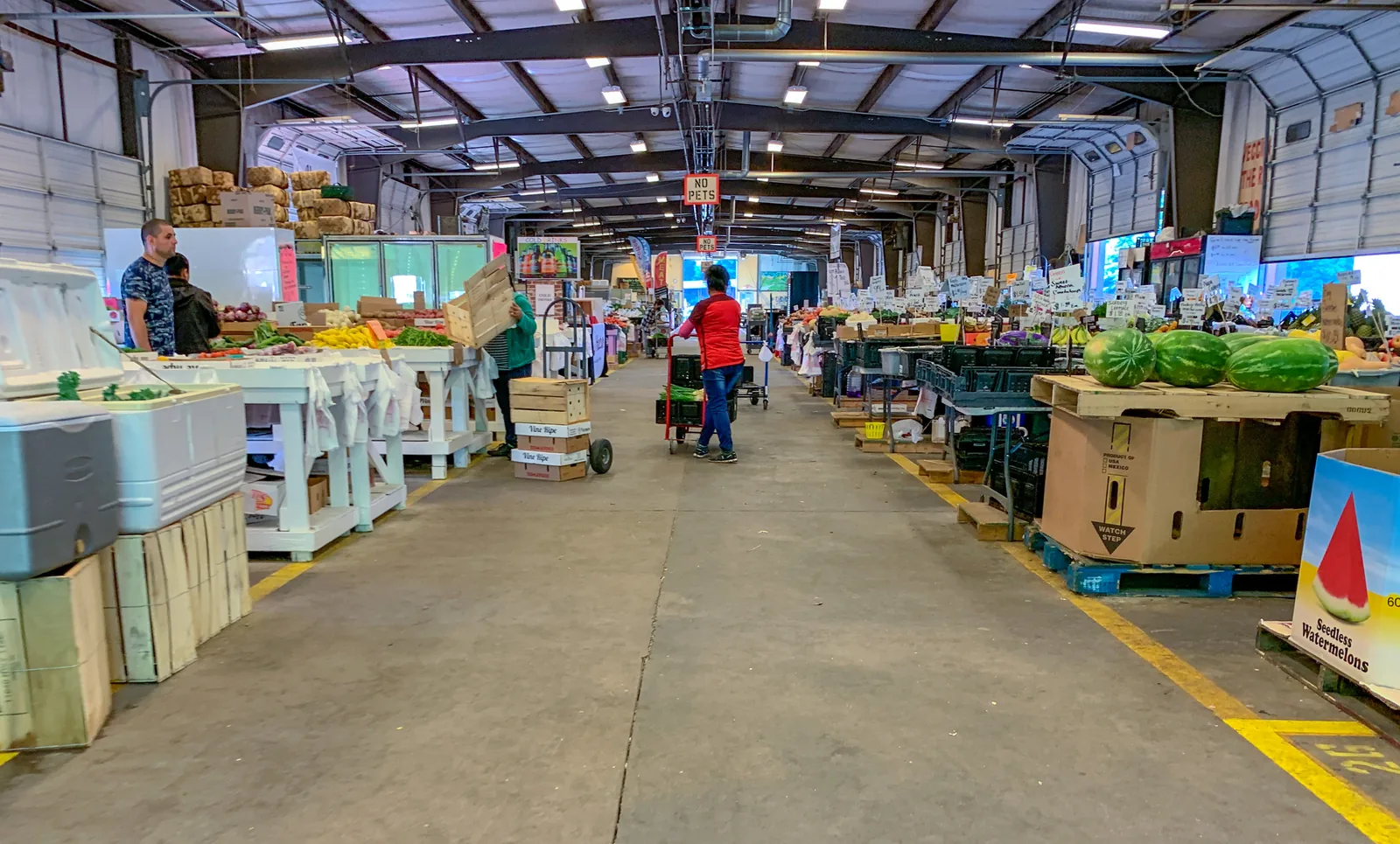 Produce stalls and watermelons inside a shed at the Charlotte Regional Farmers Market on Yorkmont Road