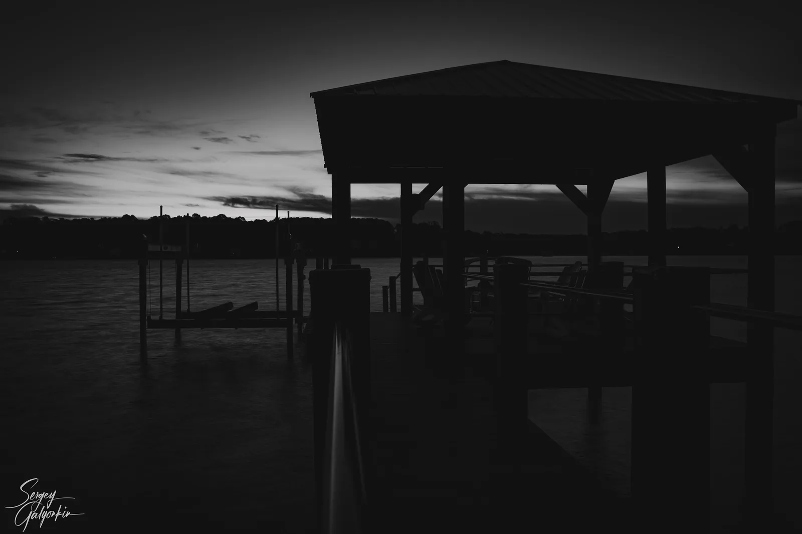 A boathouse silhouetted against the evening sky on Lake Norman