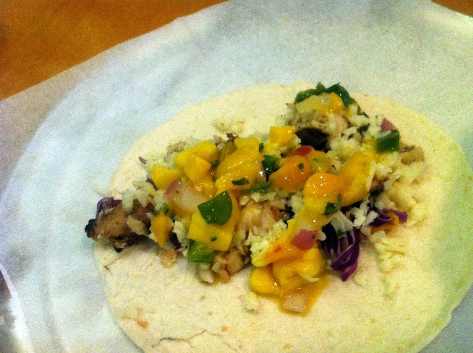 A grilled fish taco with mango salsa on a flour tortilla at a Charlotte restaurant. The photo was not taken at a Mooresville restaurant.