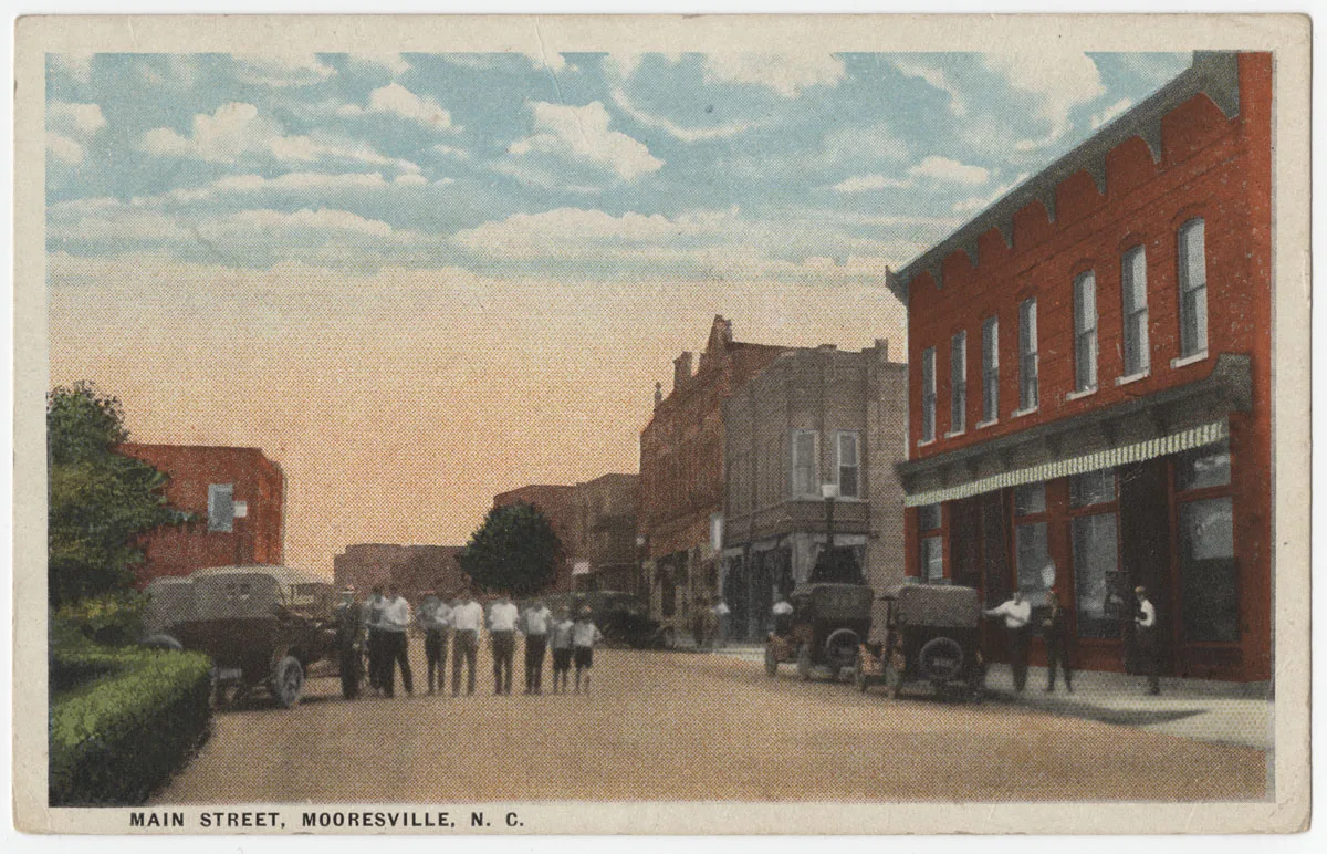 A crowd stands in Main Street in downtown Mooresville, the festival's home, on a 1925 postcard