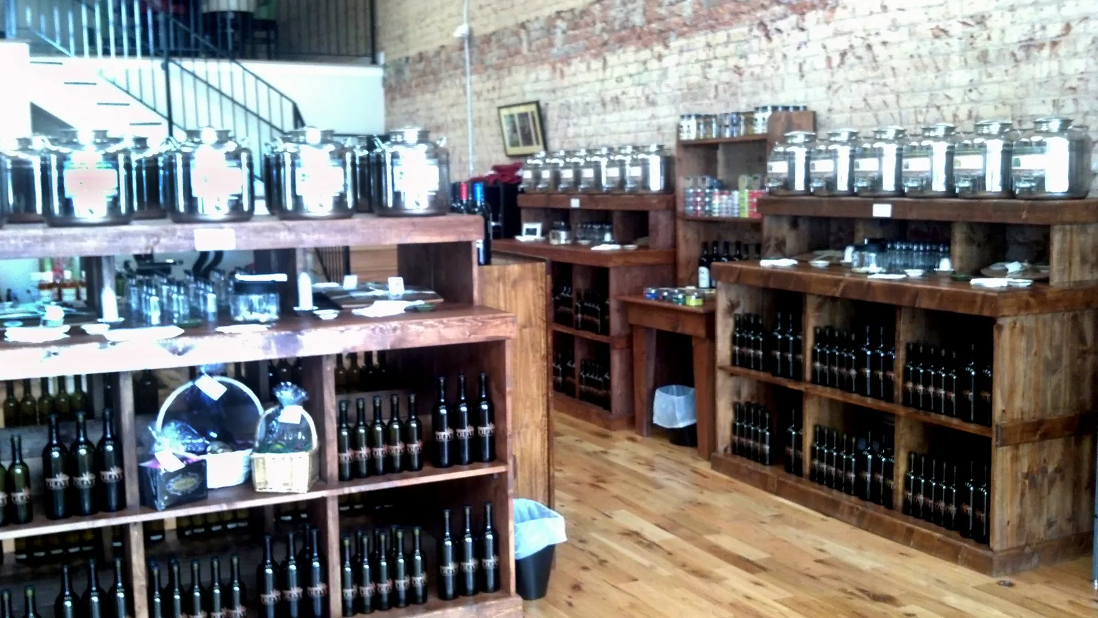 Shelves of oils and gifts inside The Enchanted Olive, a shop in Mooresville