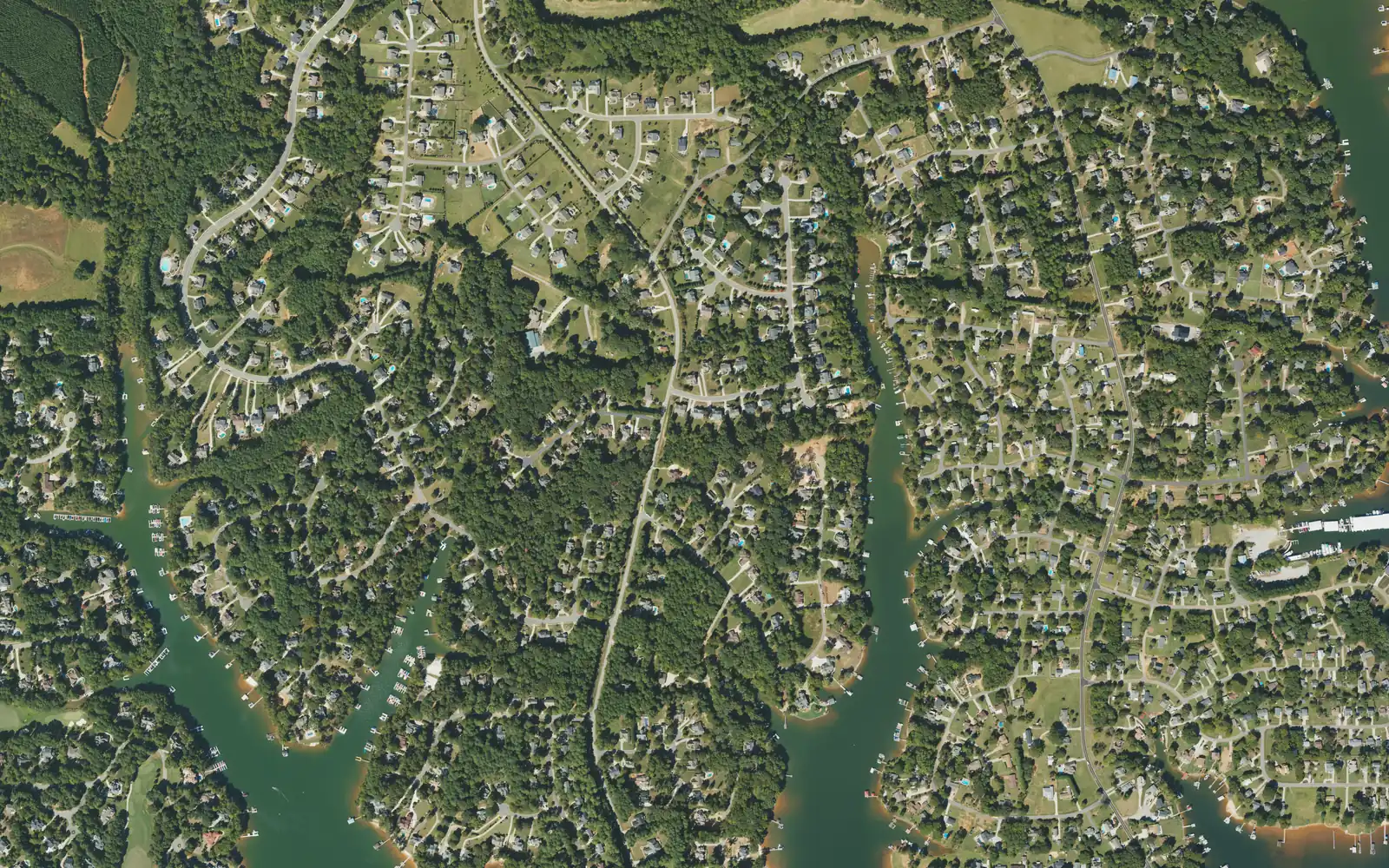 Aerial view of the Brawley School Road peninsula, with Lake Norman coves on both sides and subdivisions with boat docks along the water