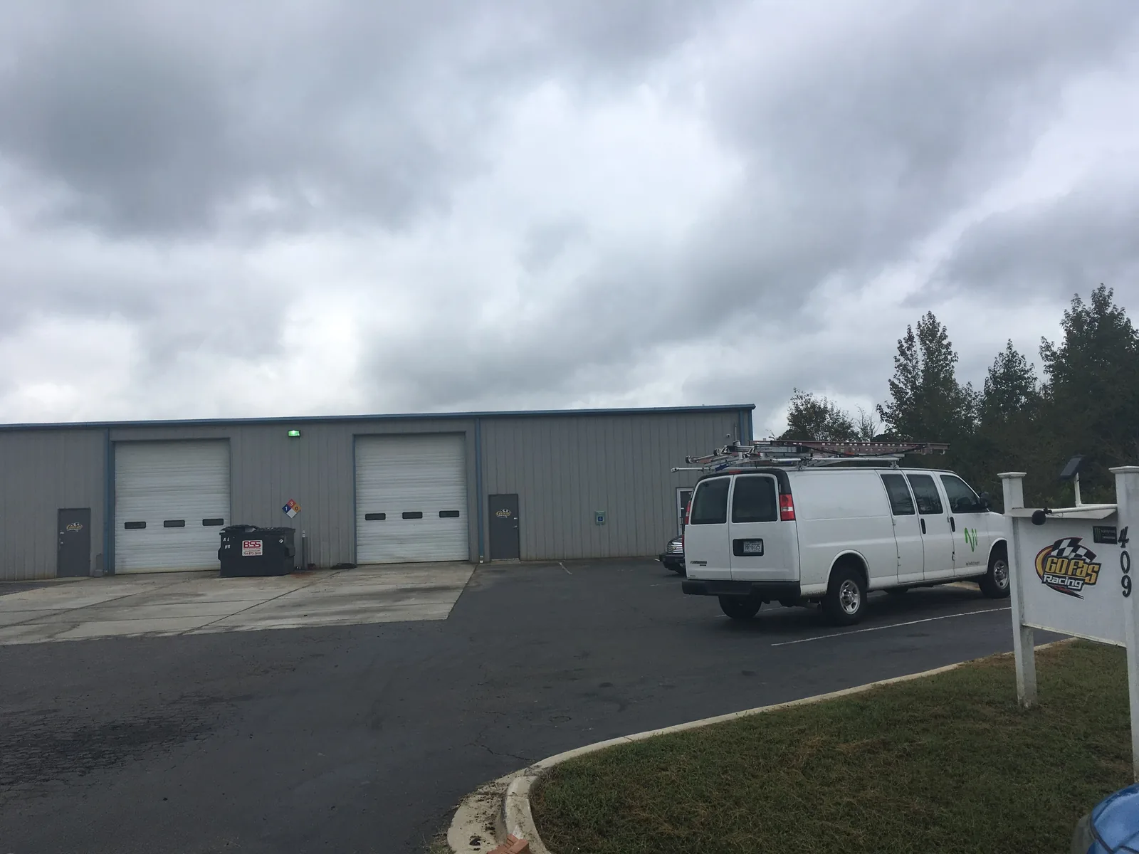 The shop building and sign of a NASCAR race team in a Mooresville business park