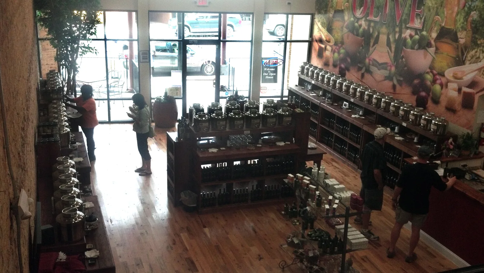 Customers inside a specialty food shop on a downtown Mooresville street