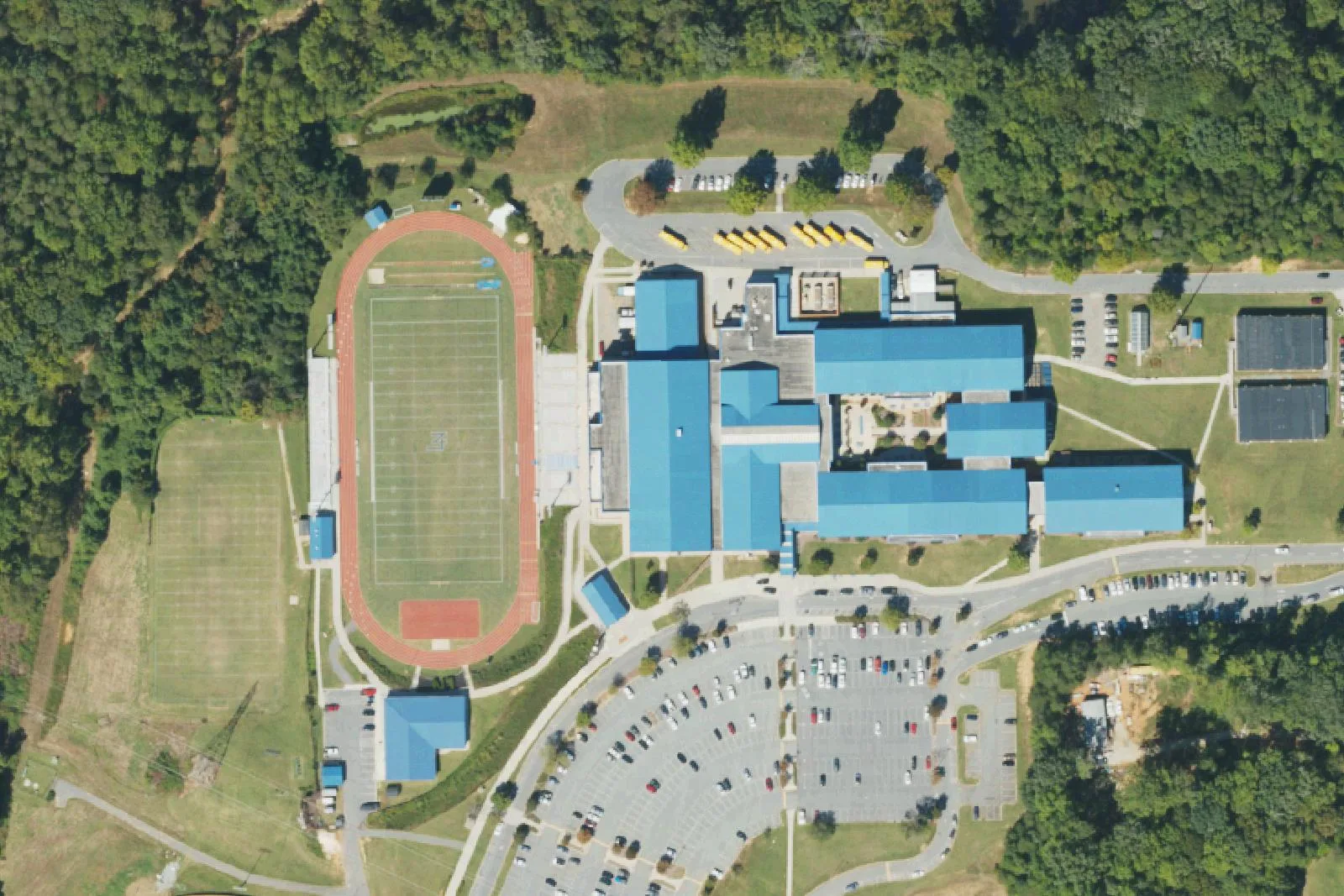 Lake Norman High School's buildings, stadium track and parking lots off Doolie Road in Mooresville, seen from the air