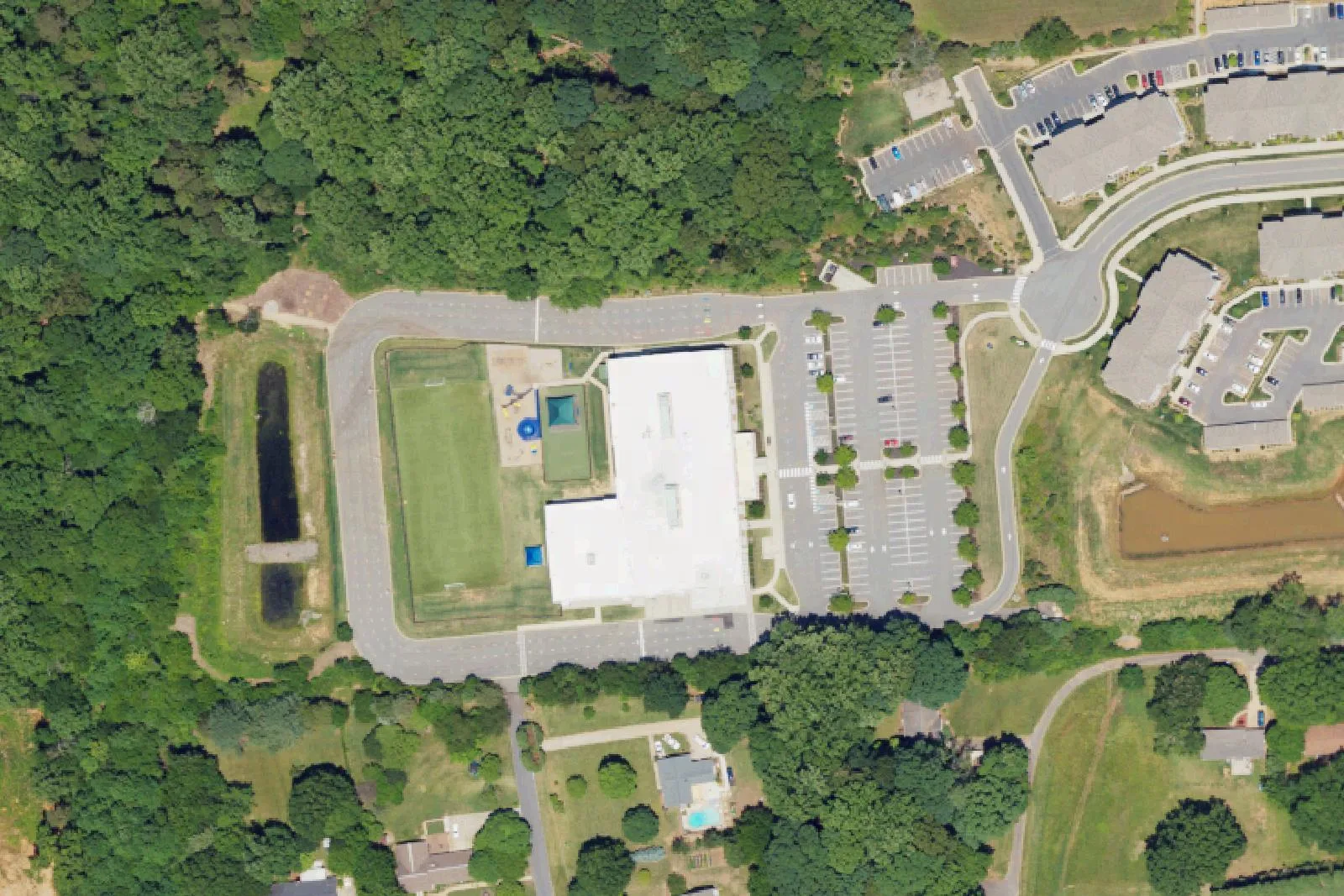 A Langtree Charter Academy campus building and its sports field off Foundation Court in Mooresville, seen from the air