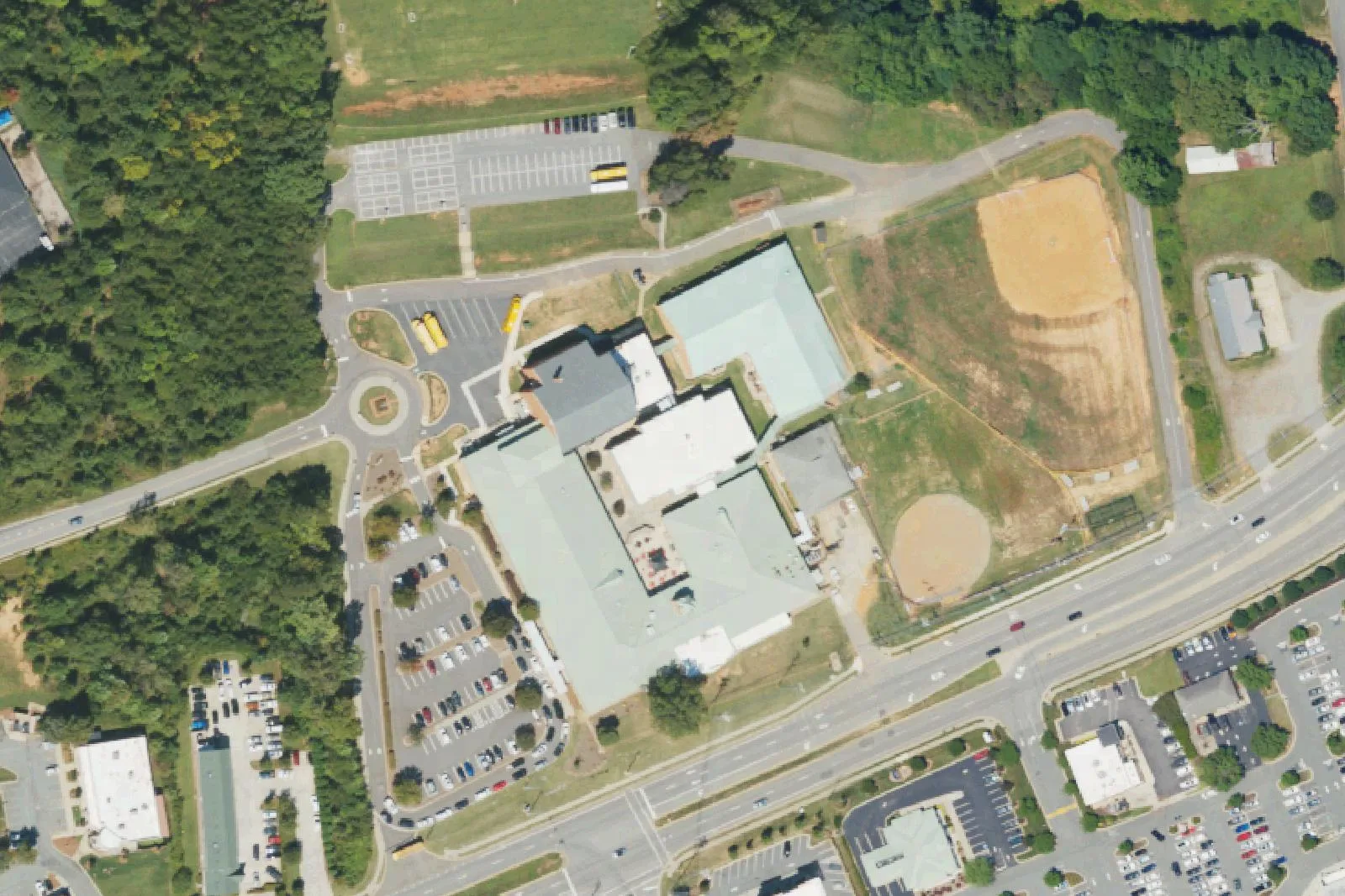 The Brawley School's buildings, traffic circle and ball field on Swift Arrow Drive in Mooresville, seen from the air